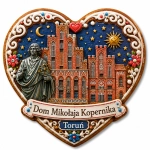 Magnes pamiątkowy Domu Mikołaja Kopernika w Toruniu z motywem astronoma i gotyckiego budynku