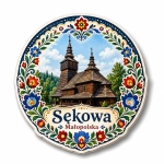 Magnes pamiątkowy z Sękowej przedstawiający drewniany kościół z dwiema wieżami i kwiatowym wzorem