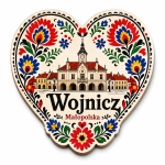 Magnes pamiątkowy z Wojnicza z motywem budynku historycznego i kwiatów w stylu folkowym
